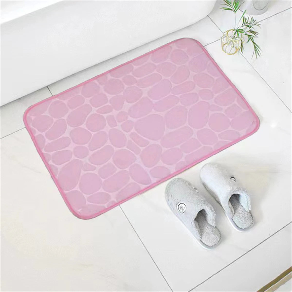 Tapis de bain mémoire de forme galet rose