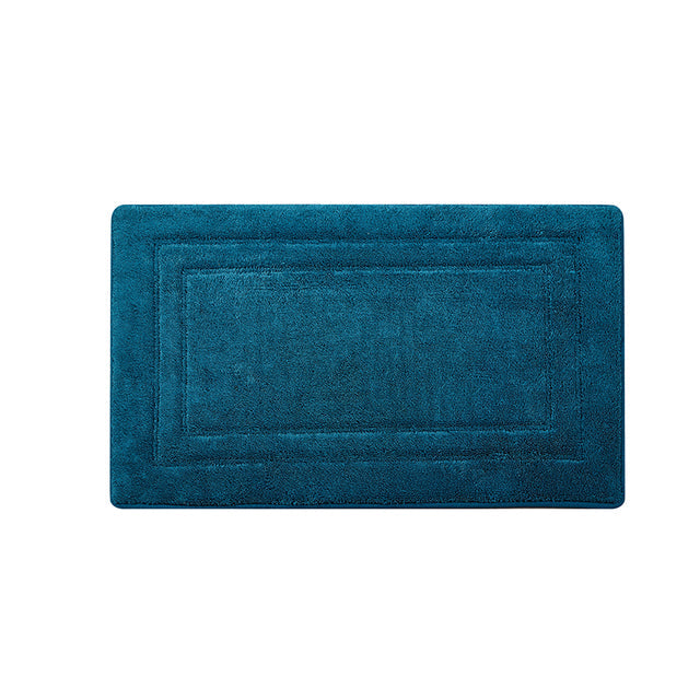 Tapis de bain bleu canard sur fond blanc