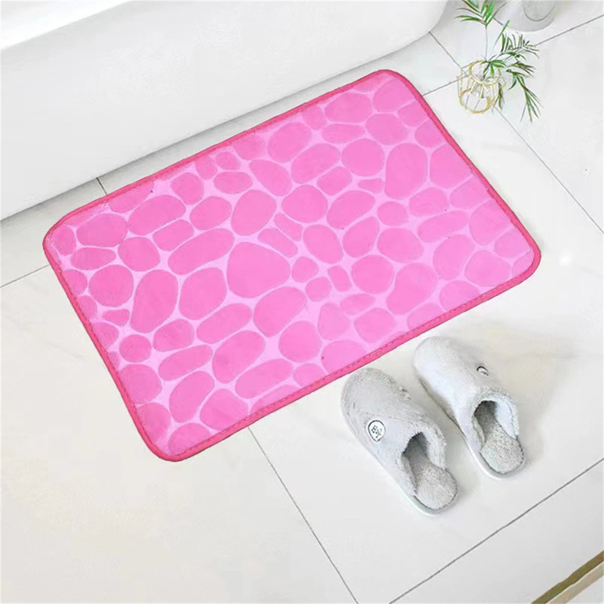 Tapis de bain mémoire de forme galet rose