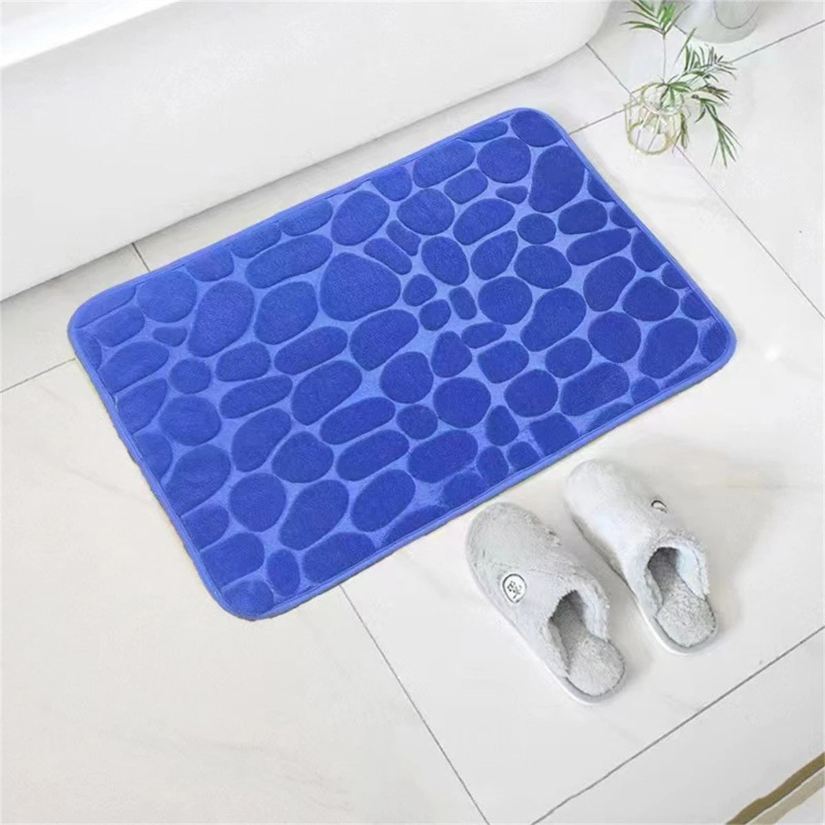 Tapis de bain mémoire de forme galet bleu